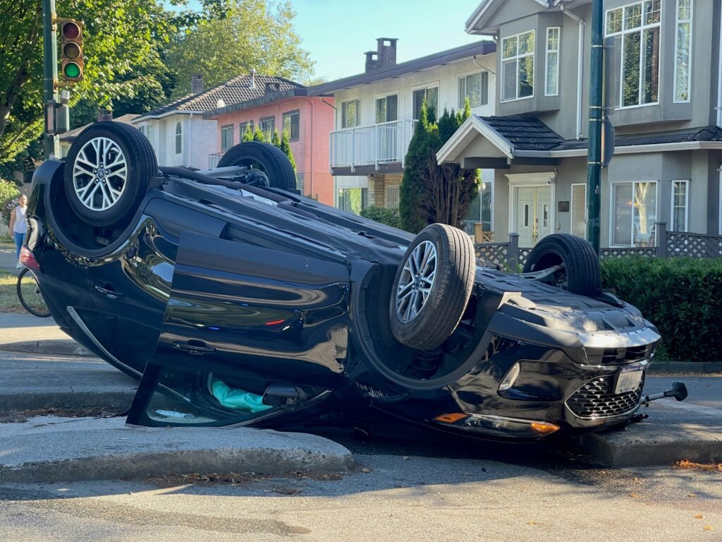 Randolph Overturned vehicle showing severe car accident damage and rollover impact in residential neighborhood