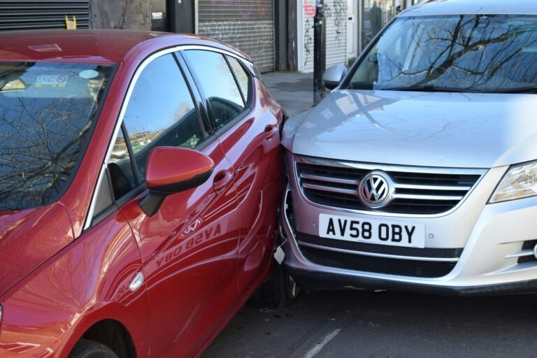 Damaged vehicles at car accident scene showing vehicle collision impact and property damage